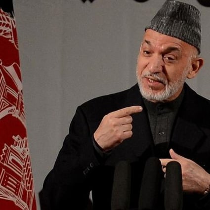 Afghan President Hamid Karzai speaks at a gathering of women to mark International Women's Day, in Kabul. Photo: AFP
