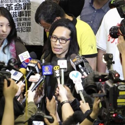 Yang Kuang meets supporters and the media after arriving at Hong Kong's airport. Photo: Felix Wong