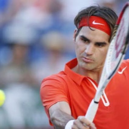 Roger Federer of Switzerland returns a shot against Ivan Dodig of Croatia during their match at the BNP Paribas Open ATP tennis tournament in Indian Wells, California. Photo: Reuters