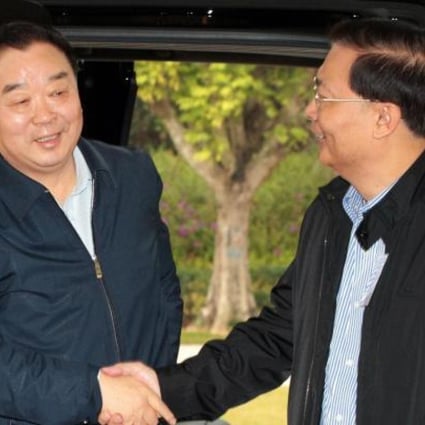 Law Committee chairman Qiao Xiaoyang (left) is greeted by Hong Kong lawmaker Tam Yiu-chung at a seminar in Shenzhen on Sunday. The topic was universal suffrage. Photo: SCMP