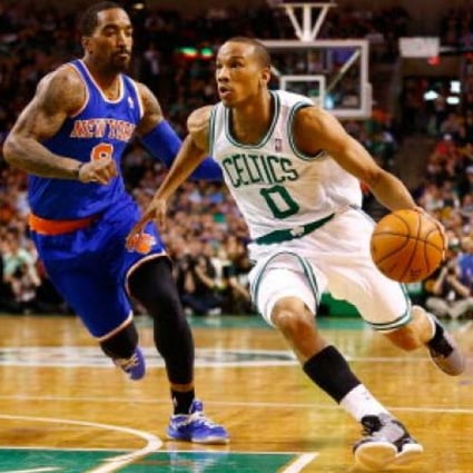 Avery Bradley #0 of the Boston Celtics drives to the basket past J.R. Smith #8 of the New York Knicks during the game  at TD Garden in Boston, Massachusetts. Photo: AFP