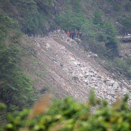 Rescuers work to clear the debris after landslides on the Guanyan Mountain section of the S210 highway in quake-hit Baoxing county, Sichuan province. Photo: Xinhua