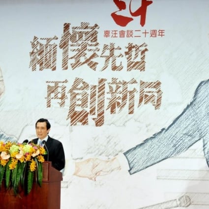 Ma Ying-jeou with a mural of the "Wang-Koo summit" yesterday. Photo: AFP