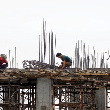 Workers at a construction site in Hanoi, Vietnam. Vietnam is one of the frontier markets that are opening up. Photo: EPA