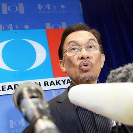 Opposition leader Anwar Ibrahim answers a question during a press conference at his party head office in Petaling Jaya on Tuesday. Photo: AFP
