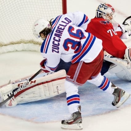 Rangers winger Mats Zuccarello scores against Capitals goalie Braden Holtby in the third period of game seven. Photo: MCT