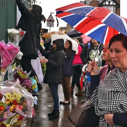 Floral tributes for Drummer Lee Rigby at the scene of his killing in Woolwich. Photo: Reuters
