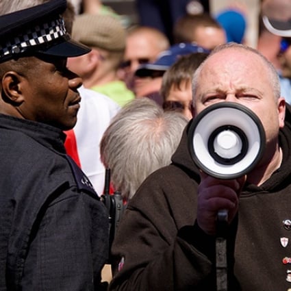 Supporters of the far-right English Defence League (EDL) shout slogans near Downing Street in central London. Photo: AFP