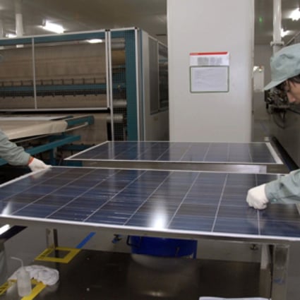 Employees work on a solar panel production line at Suntech in Wuxi, Jiangsu province. Photo: Reuters