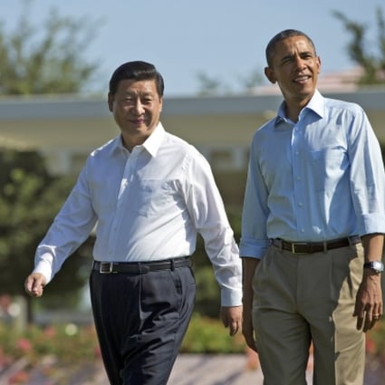 President Barack Obama and Chinese President Xi Jinping walk at the Annenberg Retreat of the Sunnylands estate. Photo: AP