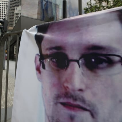 A banner supporting Edward Snowden is displayed at Central, Hong Kong. Photo: AP