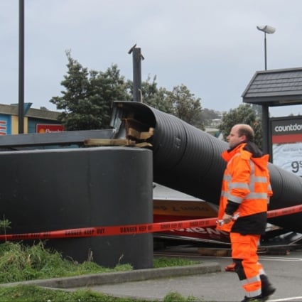 A fallen supermarket sign is seen in Wellington, New Zealand. Photo: Xinhua