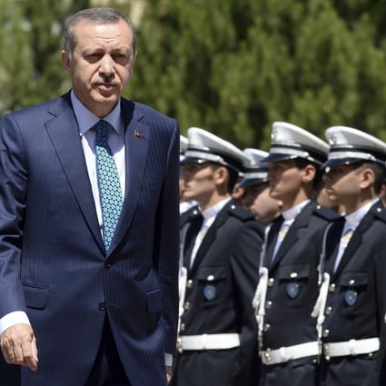 Turkey's Prime Minister Tayyip Erdogan (left). Turkish police have raided homes in the capital, Ankara, detaining people involved in protests against Erdogan's government. Photo: Reuters