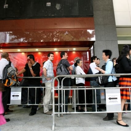 Long queues form outside the China Visa Application offices in Hong Kong. Photo: Jonathan Wong