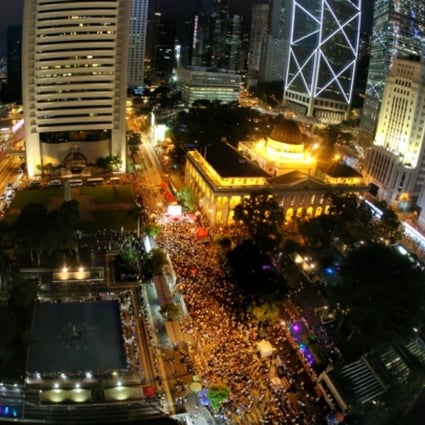 Three hundred people attend a forum on the Occupy Central movement at Chater Garden in Central last night following yesterday's march. The movement plans to occupy the central business district next July to press for democracy. Photo: Dickson Lee