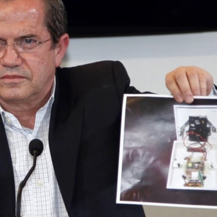 Ecuador's Foreign Minister Ricardo Patino shows a picture of a bugging device found in its London embassy. Photo: Reuters
