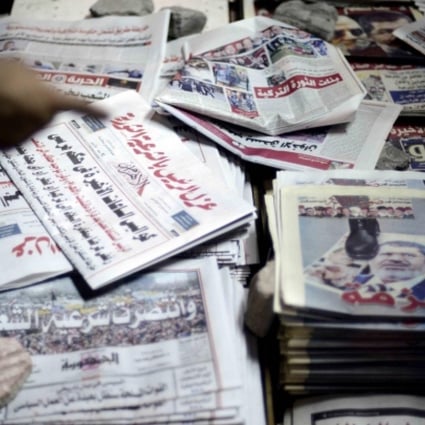 Papers report on the removal of Mohammed Mursi. Photo: AFP