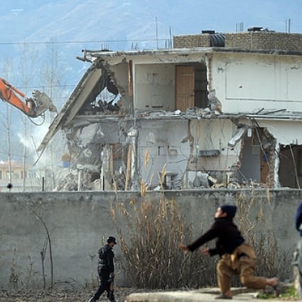 A demolition crew in 2012 works on the compound in Abbottabad where Osama bin Laden was slain. Photo: AFP
