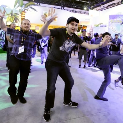 Members of the public check out a Nintendo video game at last month’s Electronic Entertainment Expo in Los Angeles. Photo: AP