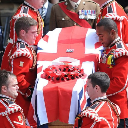 Soldiers carry Lee Rigby's coffin from the church. Photo: EPA