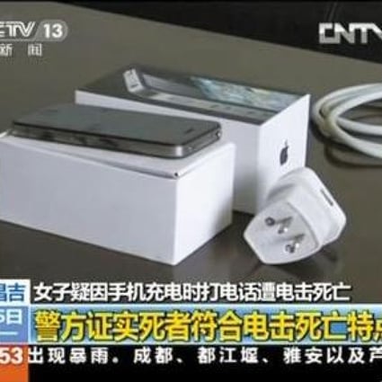 A CCTV screenshot of the phone and the charger, which does not appear to be the standard Apple mainland design. Photo: Screenshot via CCTV