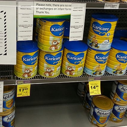 A recall notice for Karicare Gold+ Follow On Formula Stage 2 and other baby formula seen on a supermarket shelf in Wellington, New Zealand, last  Sunday. Photo: Xinhua