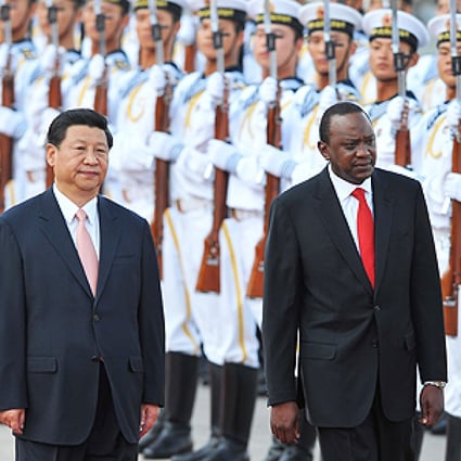 Chinese President Xi Jinping and Kenya's President Uhuru Kenyatta inspect Chinese honour guards during a welcoming ceremony outside the Great Hall of the People in Beijing on Monday. Photo: AFP 