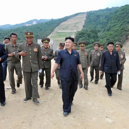Kim Jong-un and his entourage visit the site of the ski resort at Masik Pass, which he said must be finished by winter.Photo: Reuters