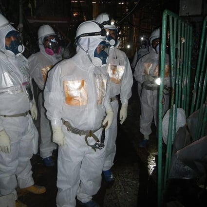 Experts visit the crippled Fukushima plant. Photo: EPA