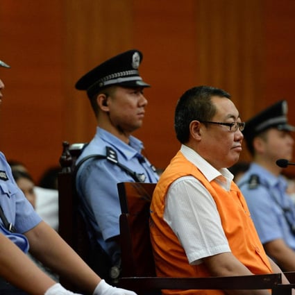 Yang Dacai, a former work safety official exposed by internet users, appears at Xian Intermediate People's Court yesterday. Photo: Xinhua