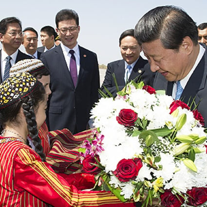 President Xi Jinping is presented with flowers yesterday upon his arrival in Ashgabat. Photo: Xinhua
