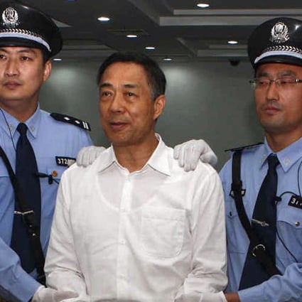 Disgraced politician Bo Xilai smiles as he arrives in court for the verdict. Photo: AFP