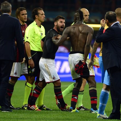AC Milan's Mario Balotelli argues with referee Luca Banti after their Serie A match with Naples. Photo: AFP