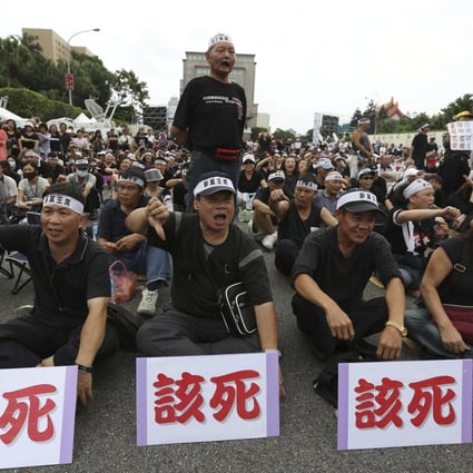 Demonstrators chant slogans during a protest against President Ma Ying-jeou outside the presidential office in Taipei. Photo: Reuters