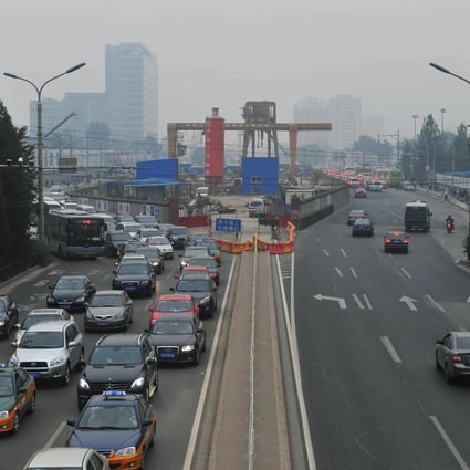 A smog-shrouded road in Beijing. Photo: Xinhua