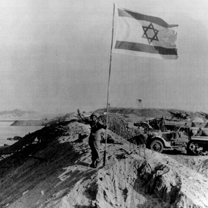 A Star of David flag on the recaptured east bank of the Suez Canal on October 30, 1973, at the end of the Yom Kippur war. Photo: AP