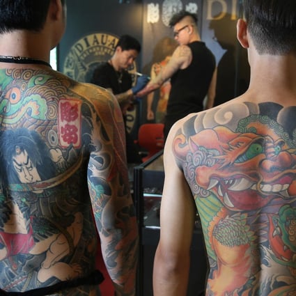 Models show off their full back tattoos by award-winning Taiwanese artist Chen Cheng Hsiung, better known as Diau An. Photo: K.Y. Cheng