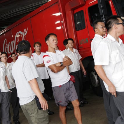 Swire Coca-Cola HK deliverymen stop work over concerns about outsourcing, lower pay and long hours. Photo: David Wong