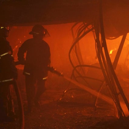 Firefighters try to control a fire inside the garment factory in Gazipur. Photo: Reuters