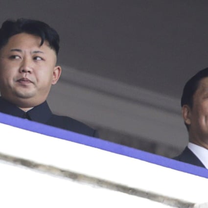 North Korean leader Kim Jong-un salutes next to China's Vice President Li Yuanchao during a parade in Pyongyang. Photo: Reuters