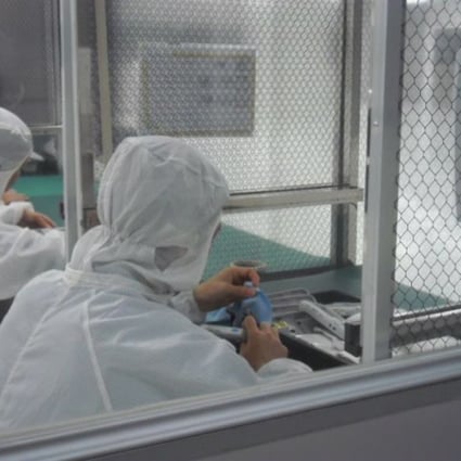 Meticulous assembly of a medical device in a clean room at PartnerTech Dongguan