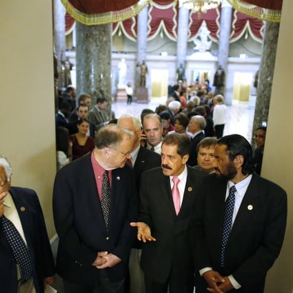 US House Democrats line up to march onto the House floor to address the government shutdown, at the US Capitol in Washington. Photo: Reuters