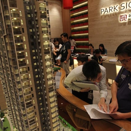 Potential buyers check the Park Signature sales office at Discovery Park in Tsuen Wan. Photo: May Tse