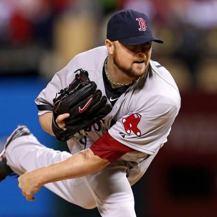 Jon Lester enjoys another fine outing, this time helping the Boston Red Sox to a 3-1 victory against the Cardinals in game five of the World Series. Photo: AFP