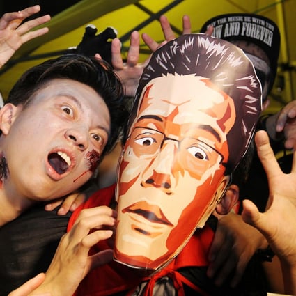 HKTV supporters get into the Halloween spirit as they protest outside government headquarters. Photo: Nora Tam