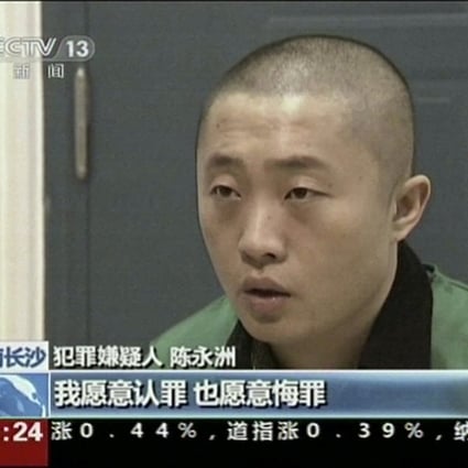 Chinese journalist Chen Yongzhou is shown confessing on state television. Photo: AP