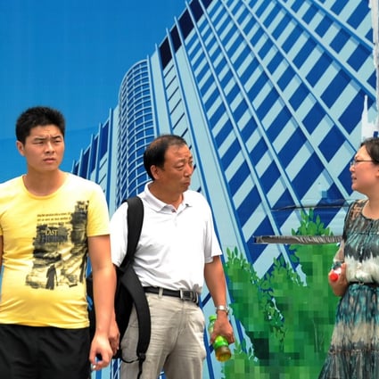 Promotions for home projects in Shanghai keep housing on residents' minds, but it is now to tougher to buy additional homes. Photo: AFP