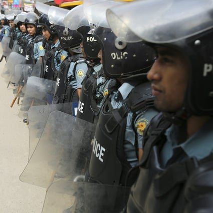Security officials stand guard in the streets during the the first day of the countrywide shutdown called by the Bangladesh Nationalist Party. Photo: EPA