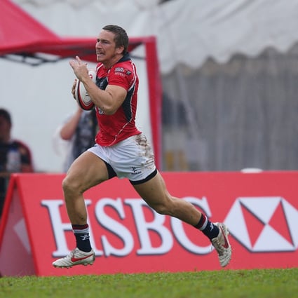Tom McQueen heads for the try line in Hong Kong's 10-0 win over China on the first day of the Singapore Sevens. Photo: SCMP Pictures