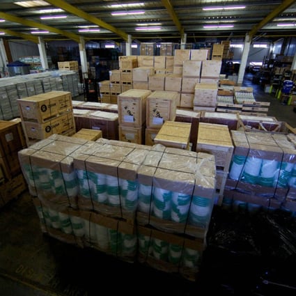 Aid packages as part of efforts to assist victims of Typhoon Haiyan are ready to be shipped in an Oxfam UK warehouse. Beijing's initial US$200,000 donation to the Philippines has drawn criticism. Photo: AFP